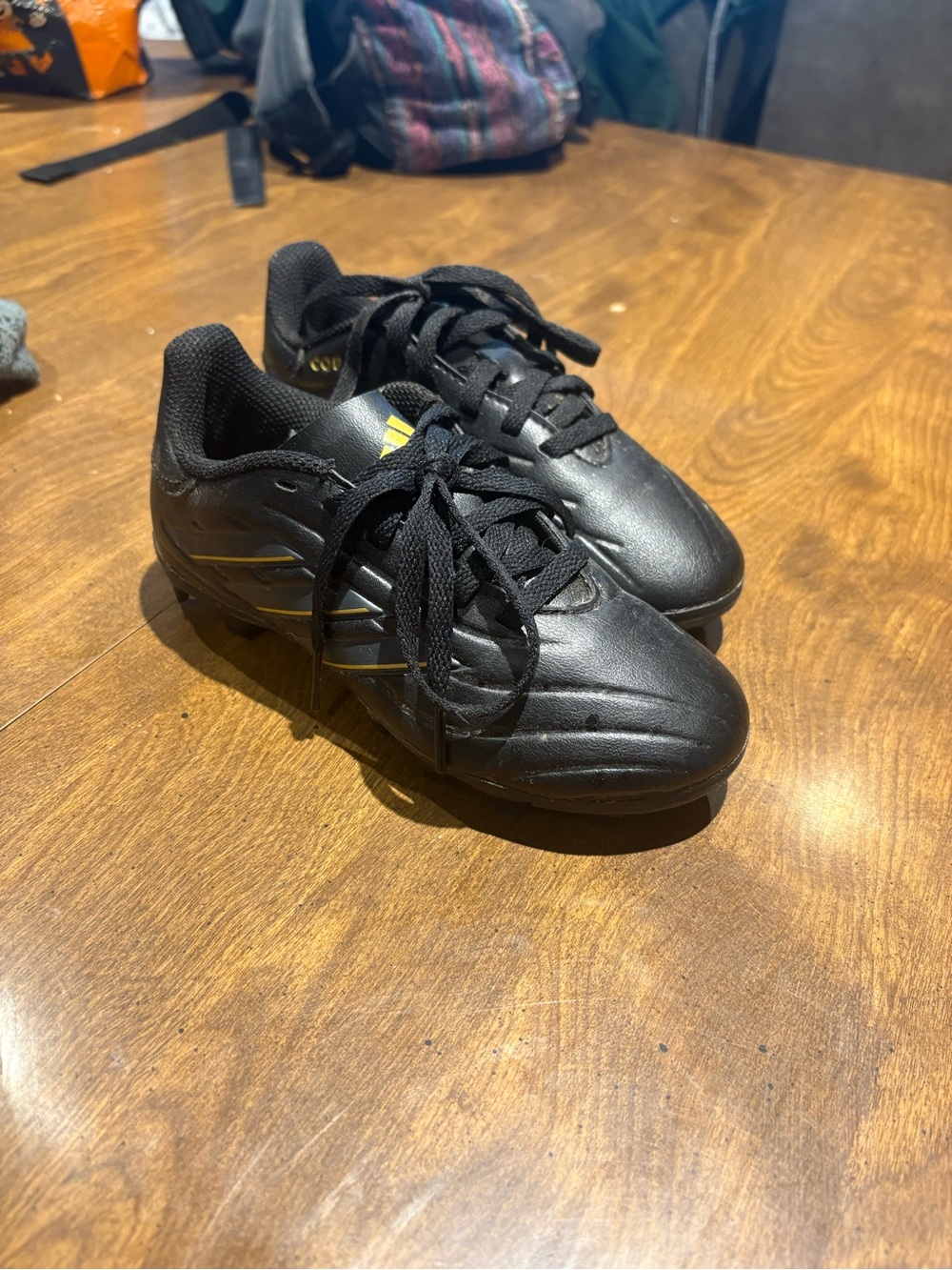 adidas Kids Black Soccer Sneakers with Subtle Yellow Accent